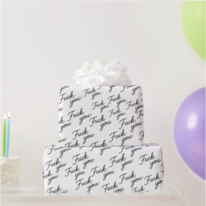 Playful wrapping paper pattern with the phrase Fuck You written in cursive, repeated diagonally across a white background. Surrounded by colorful birthday candles and balloons, giving the design a sarcastic but lighthearted party vibe. Perfect for gag gifts, birthdays, or anyone who deserves attitude with a smile.